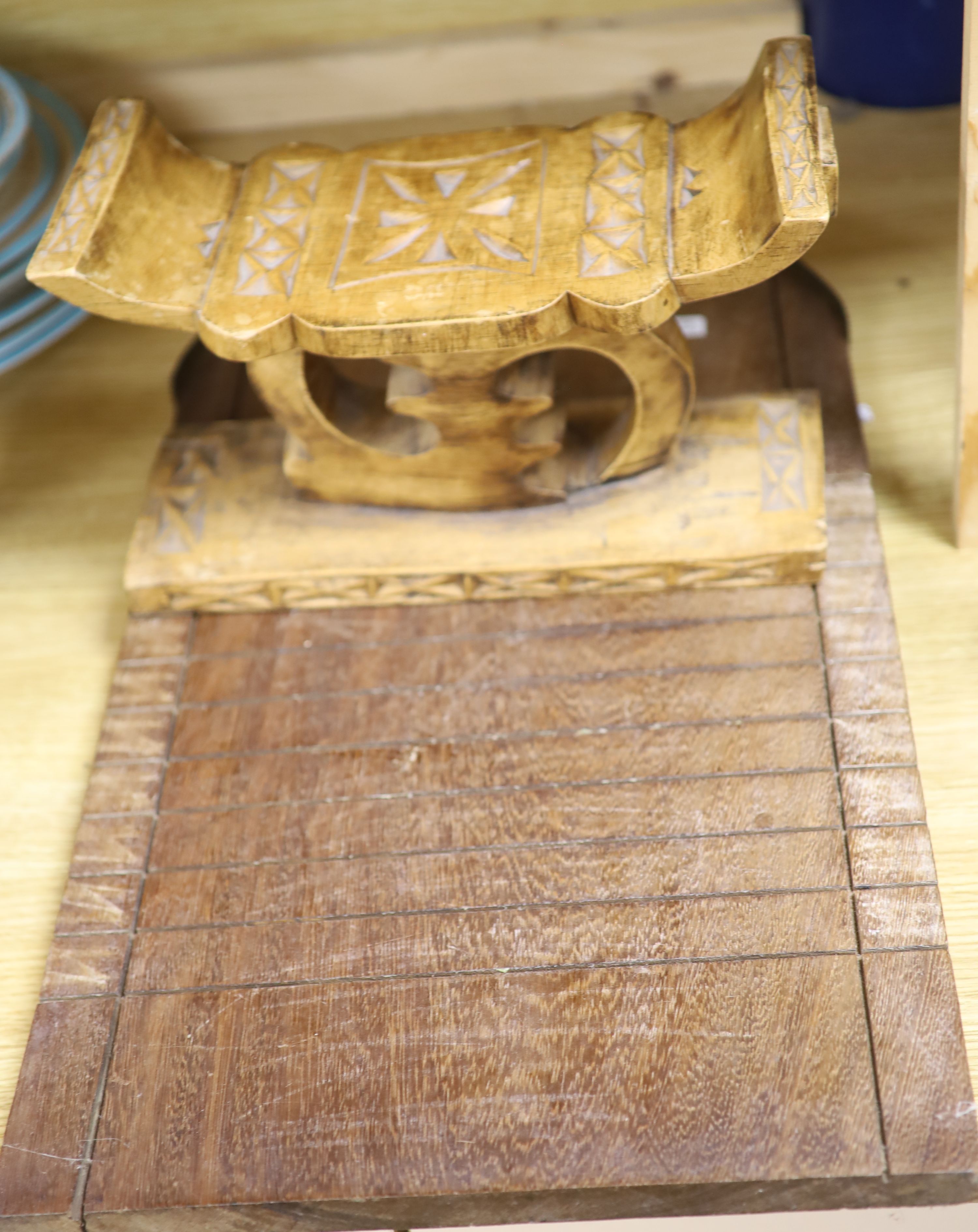 An Ashanti style stool and a shove hapenny board